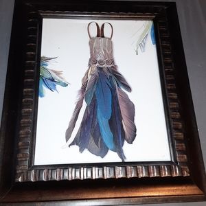 Framed artwork, feather dress